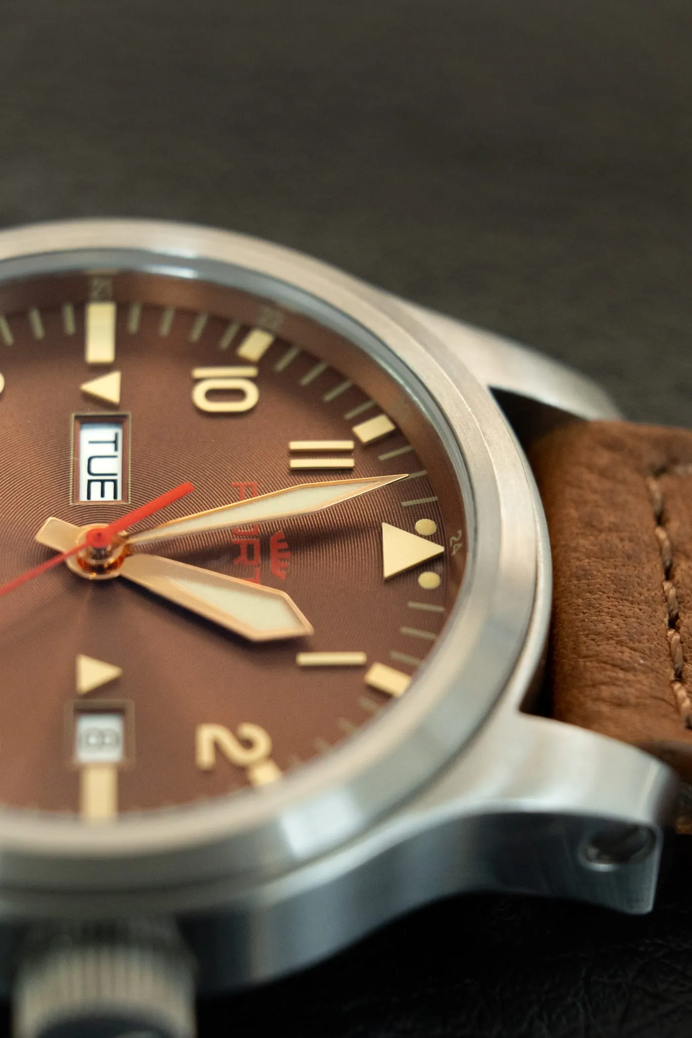Close-up of the Fortis B-42 dial, hands and brushed steel case