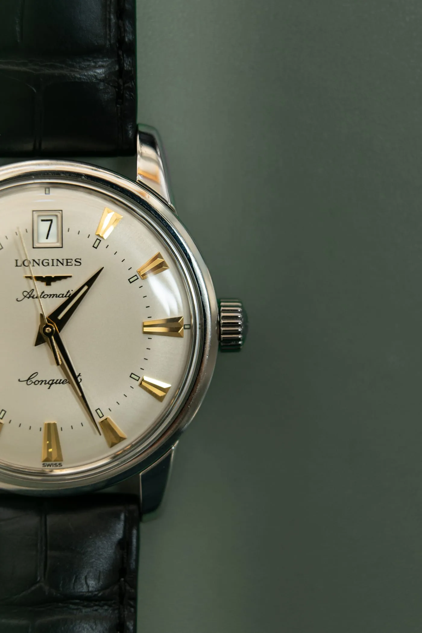 Longines Conquest automatic with gold hour markers on the bench at SwissMade
