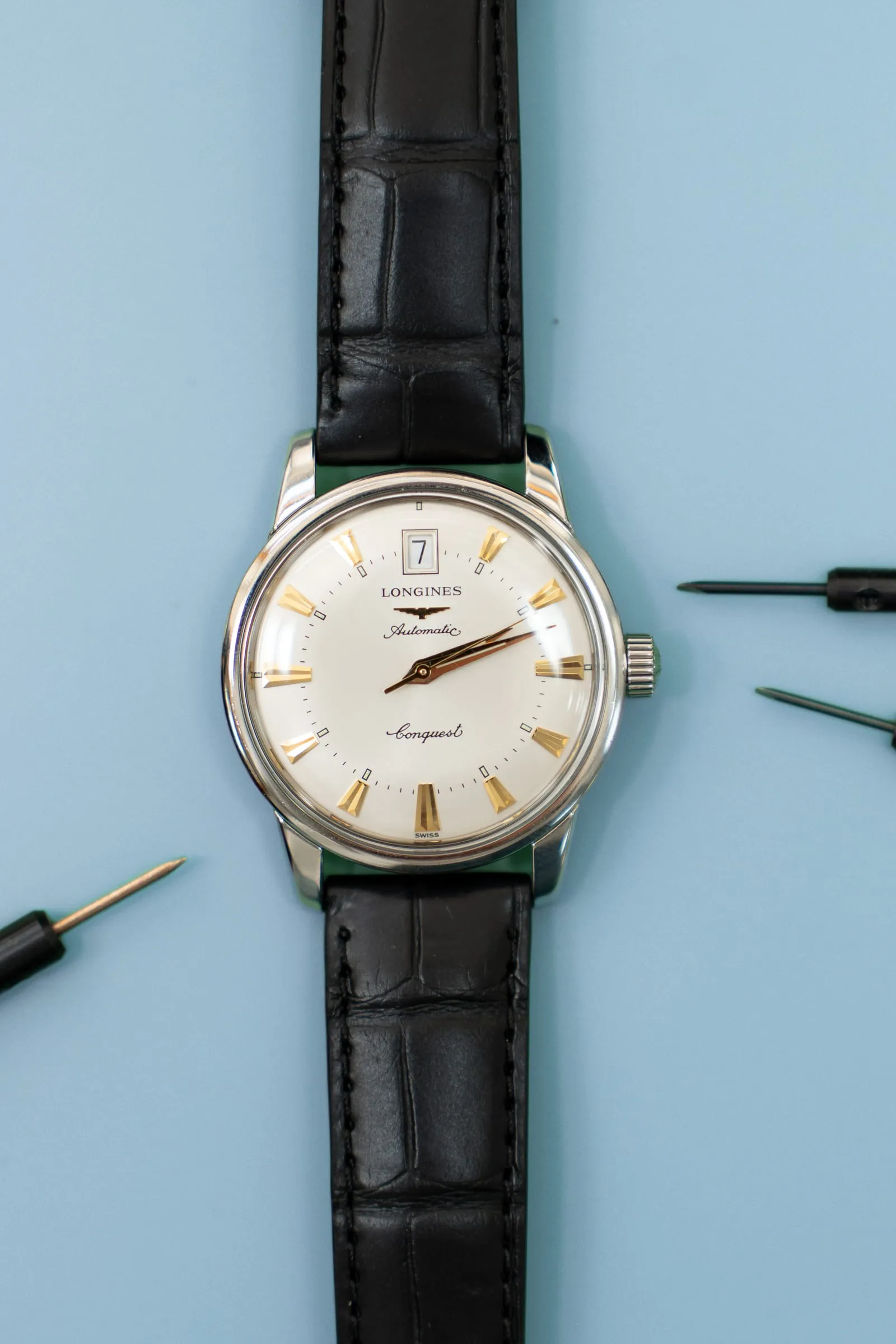 Vintage Longines Conquest with gold markers on a black strap
