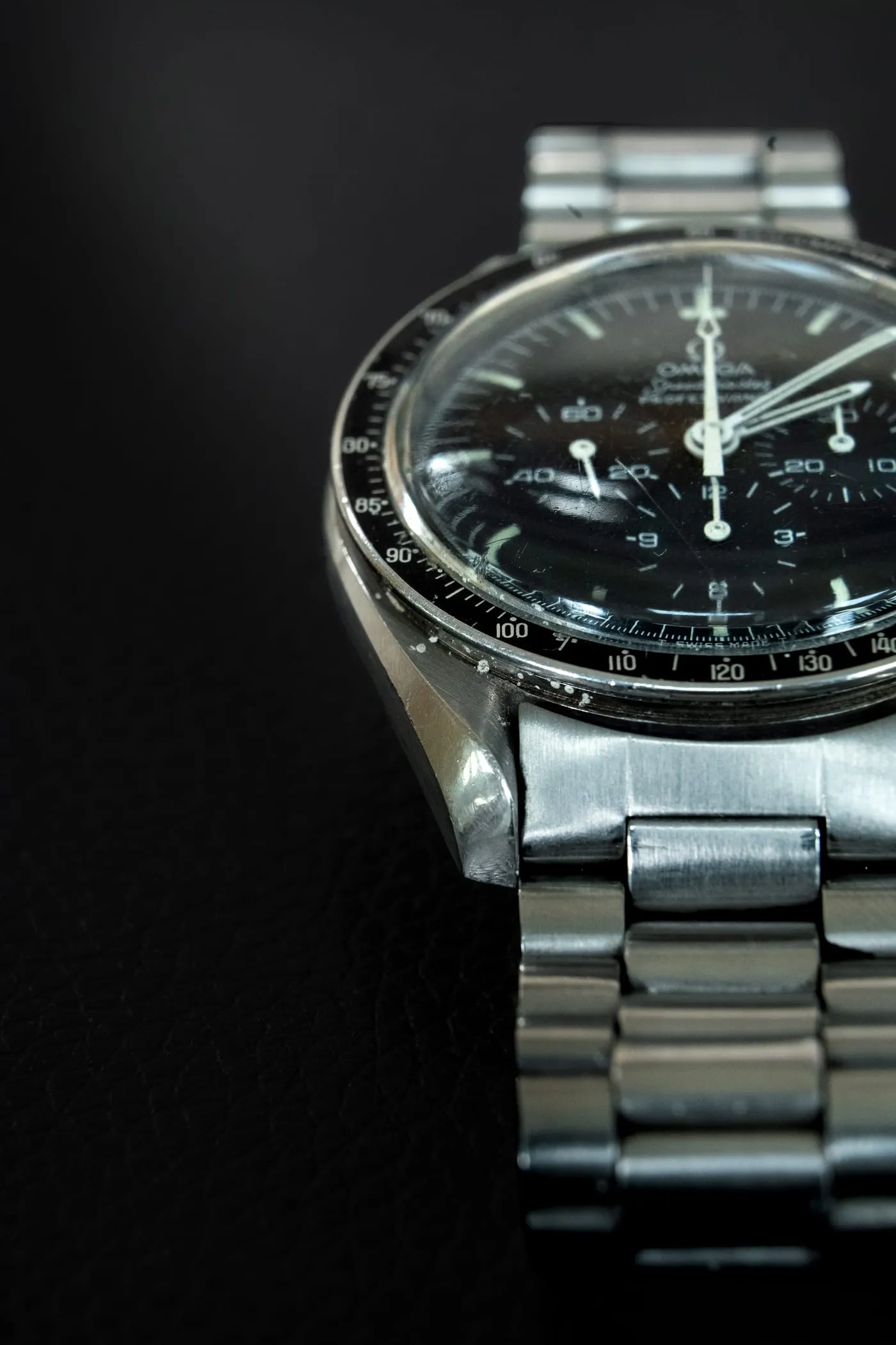 Omega Speedmaster with black dial on a steel bracelet