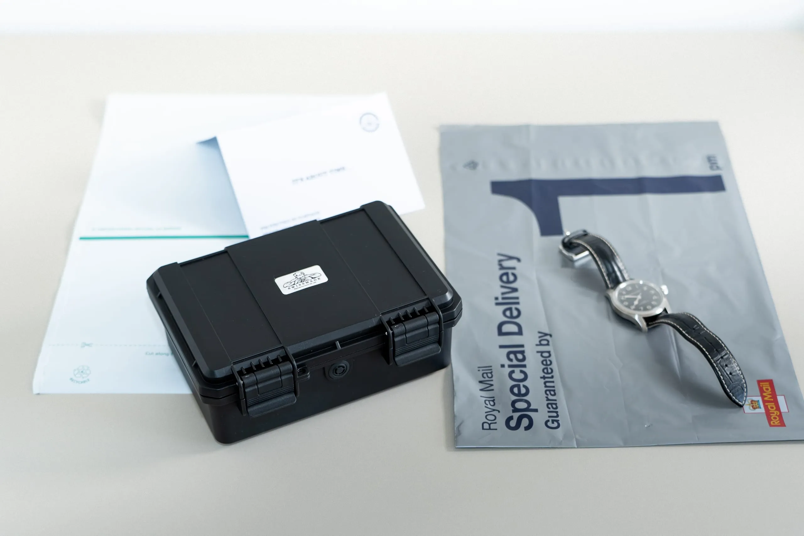 SwissMade free insured postage pack: protective case, prepaid mailers and instructions