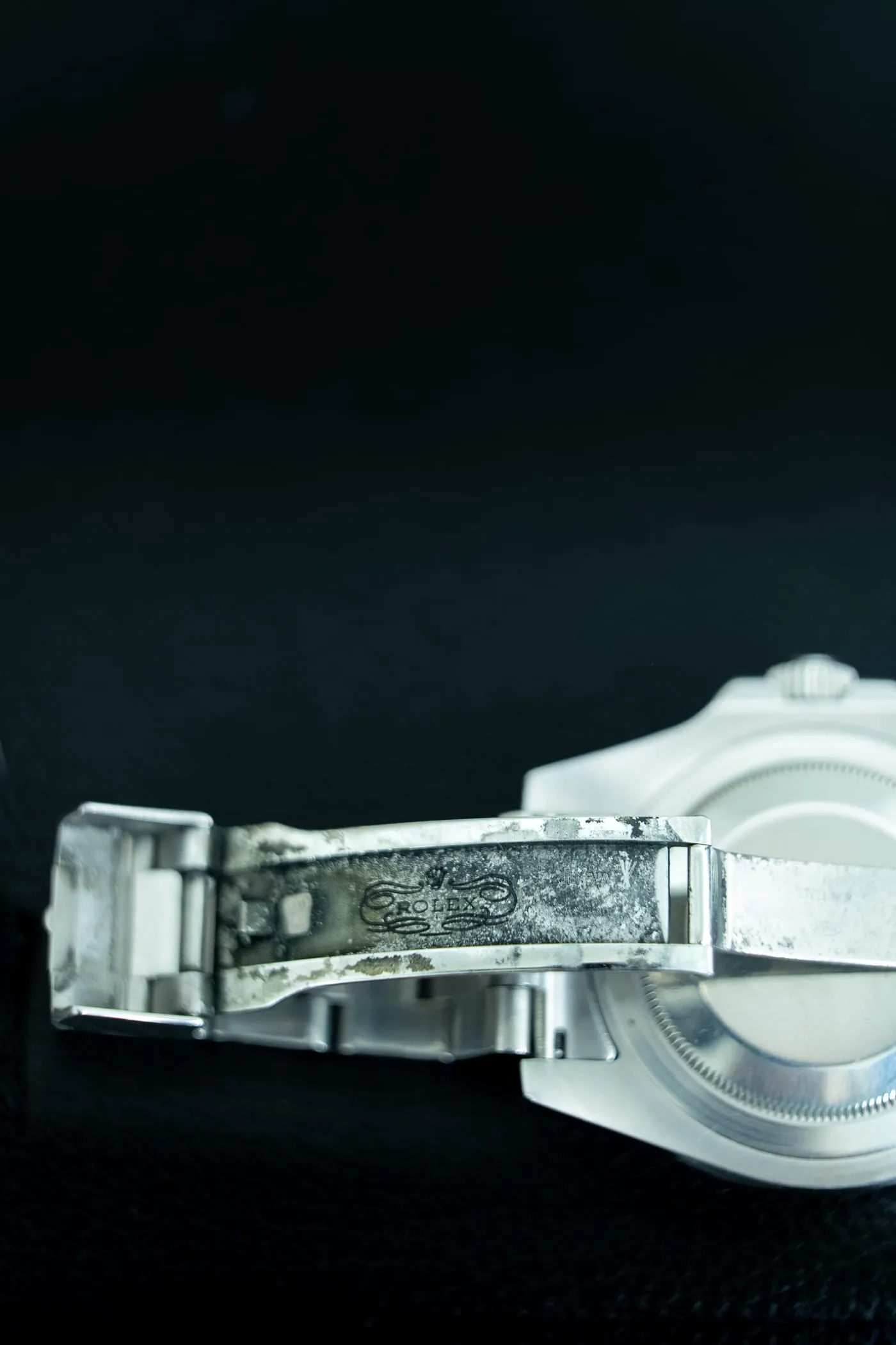 Worn Rolex bracelet clasp before cleaning and refinishing