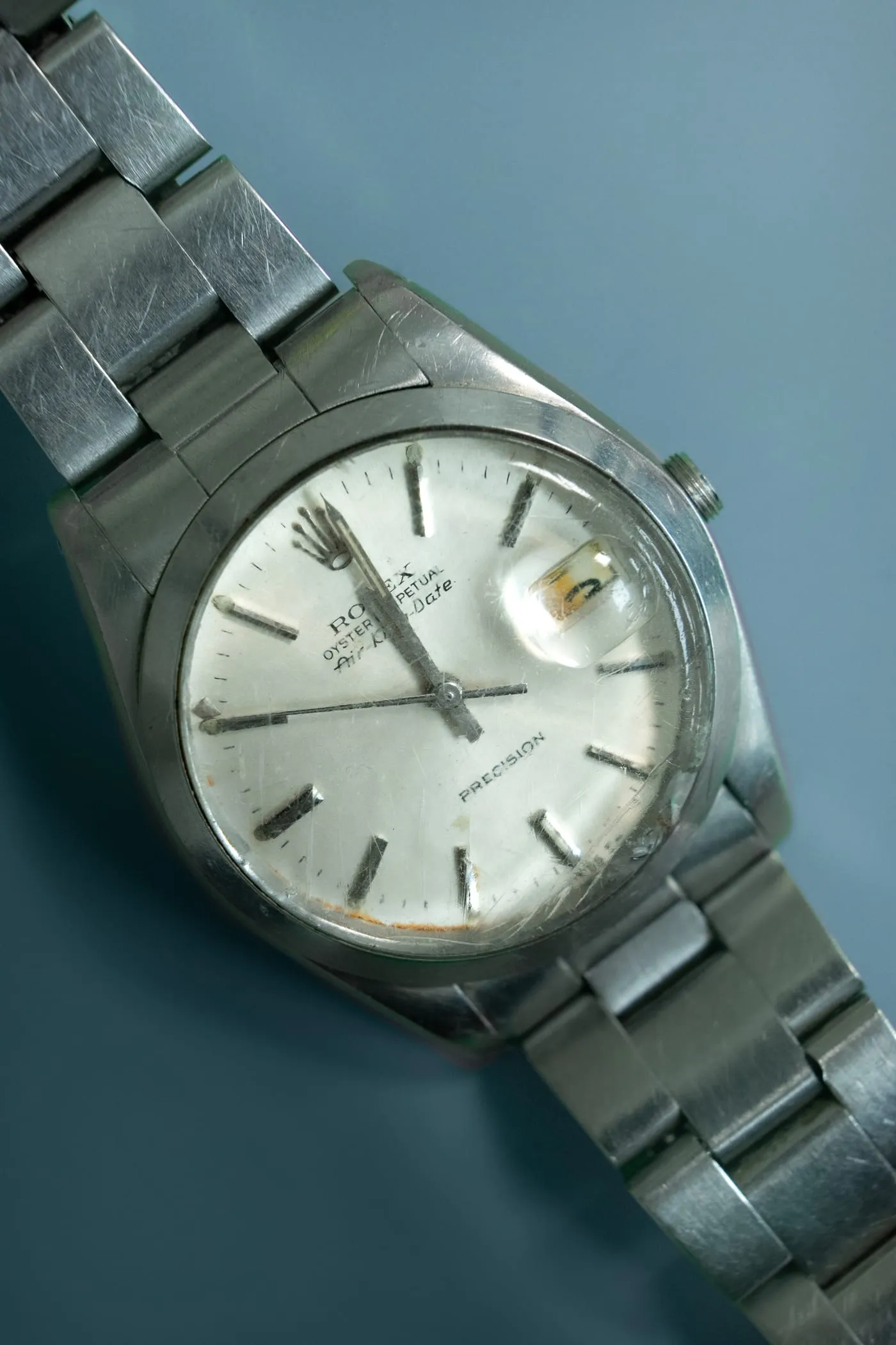 Vintage Rolex Oysterdate Precision with a scratched crystal before restoration