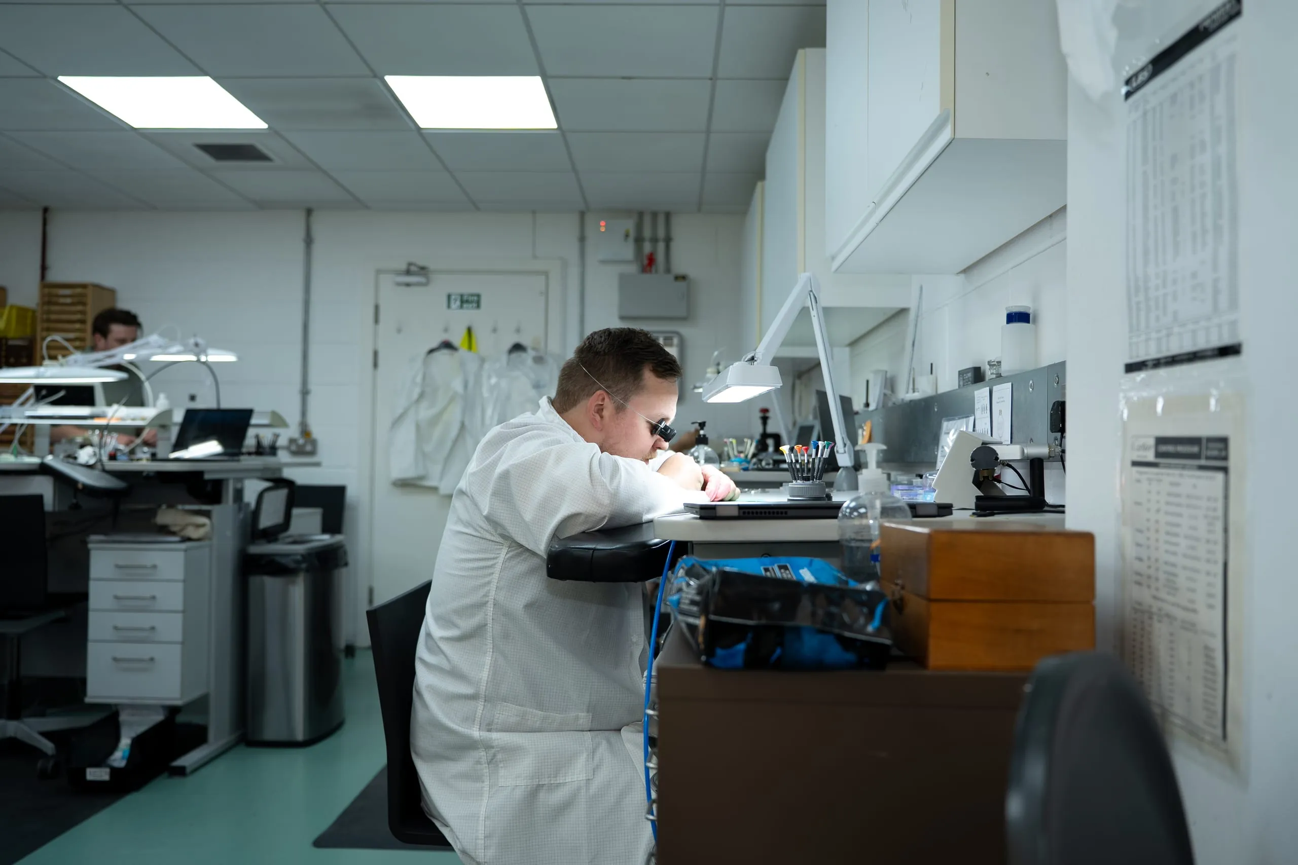 SwissMade watchmaker carrying out maintenance at his bench