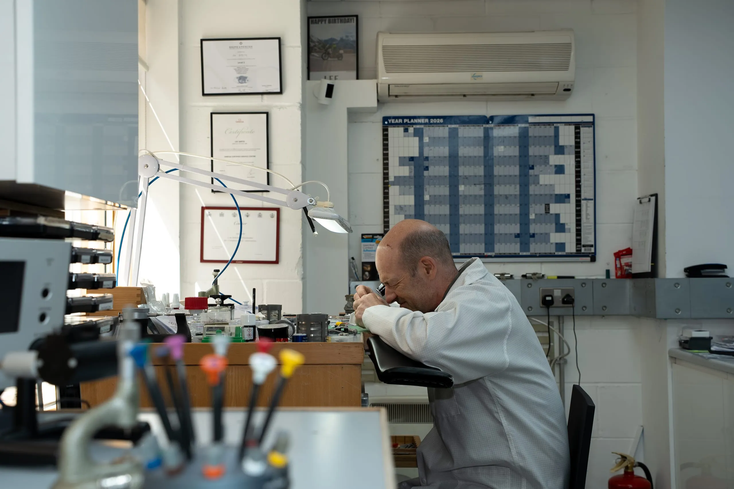 SwissMade watchmaker at the bench in the Hatton Garden workshop