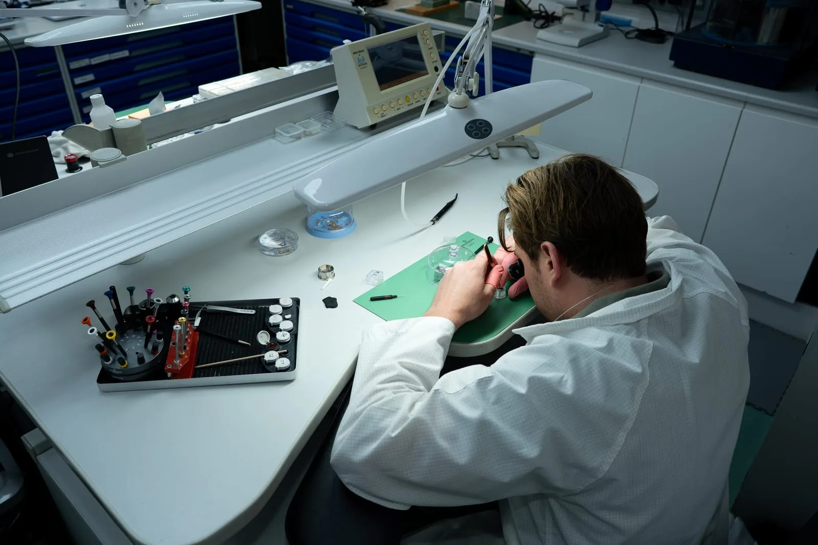 Watch movements in trays during servicing at the SwissMade workshop